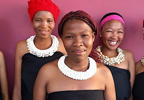 Five Namibian ladies display their stunningly crafted necklaces.