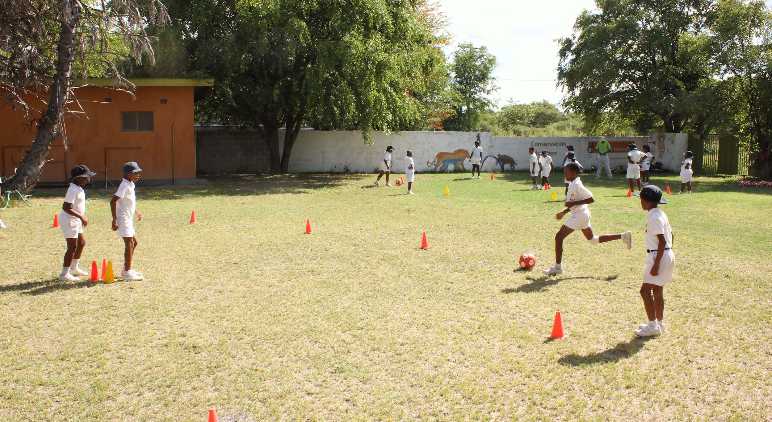 A group of Batswana children playing football.
