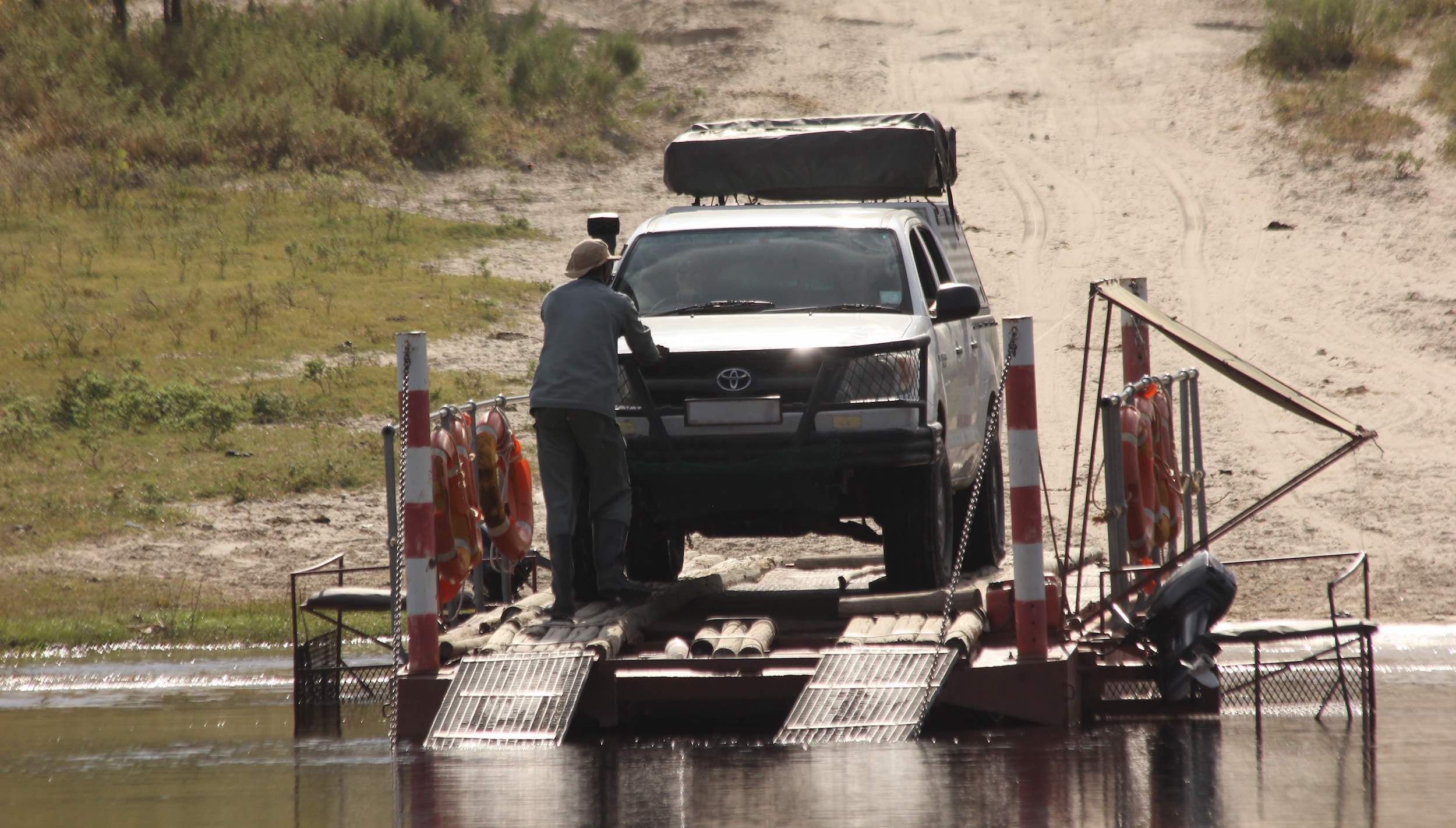 A Toyota bakkie prepares to cross the Boteti river on the local ferry.