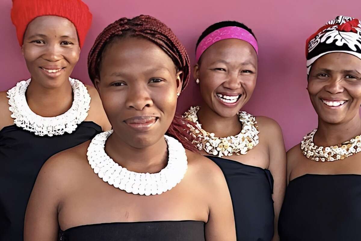 Four Namibian ladies display their stunningly crafted necklaces.