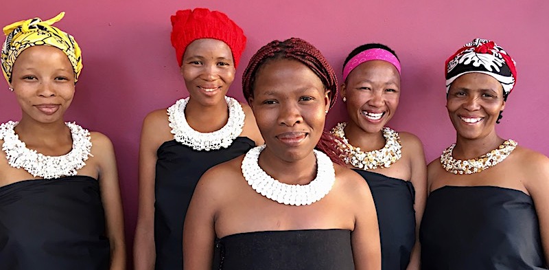 Five Namibian ladies display their stunningly crafted necklaces.