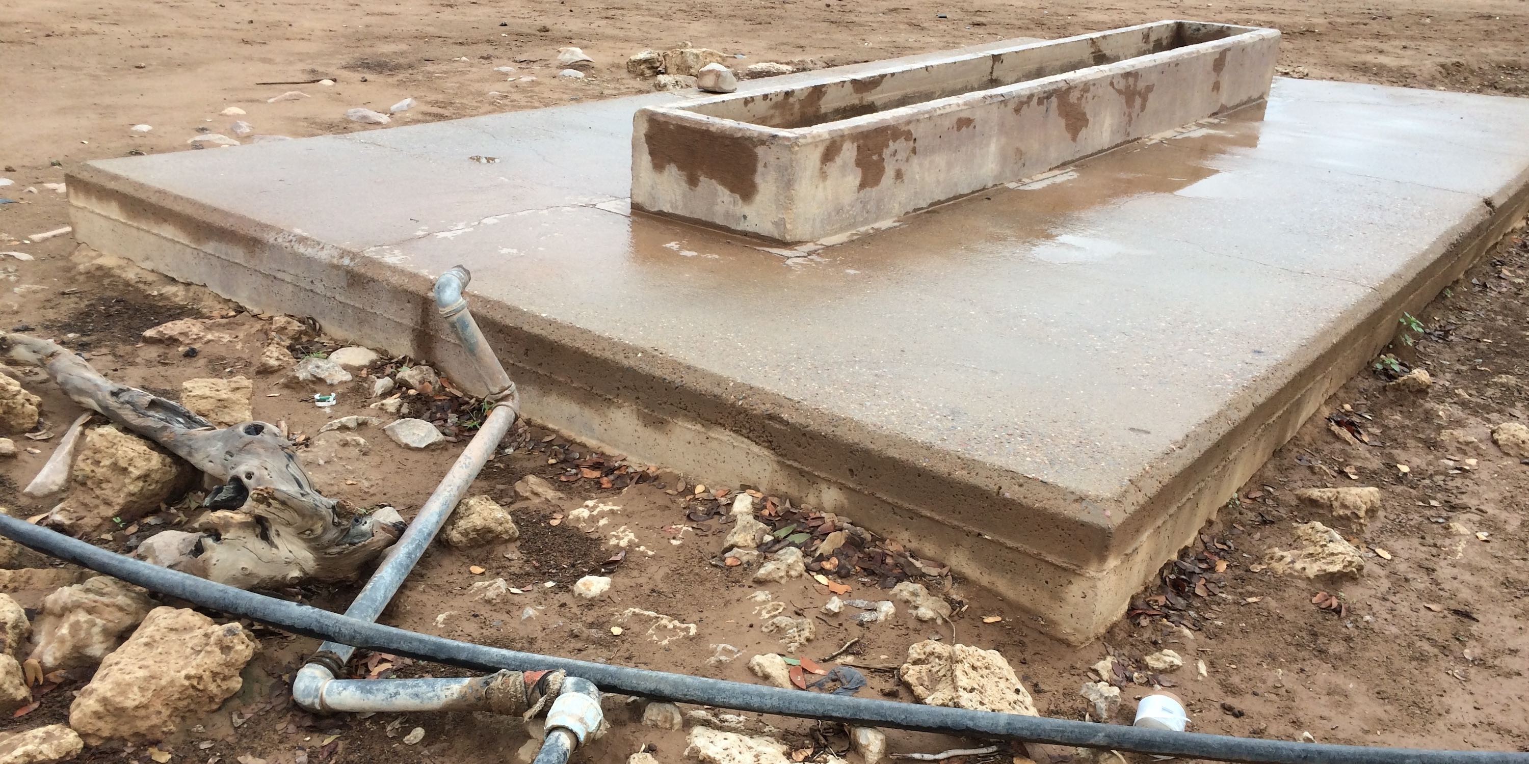 Pipes leading to a cement waater trough have been riped out by elephants seeking water.