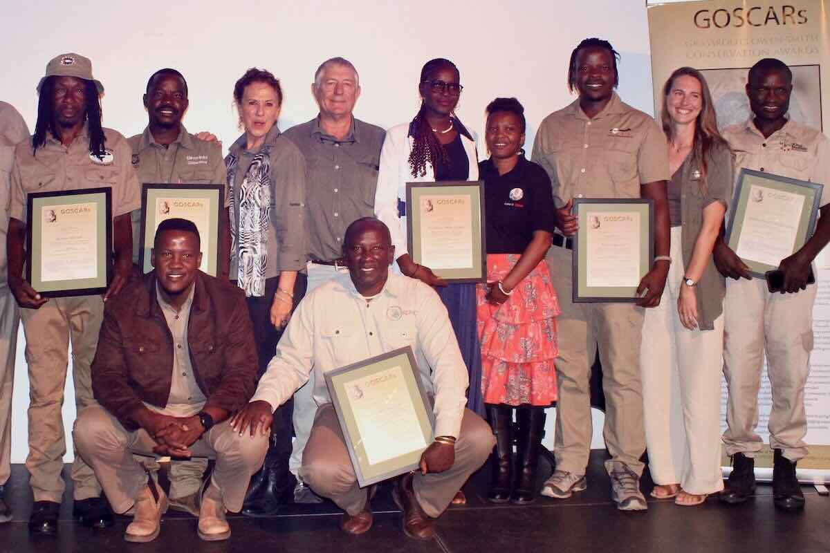 The award winners post together on stage.