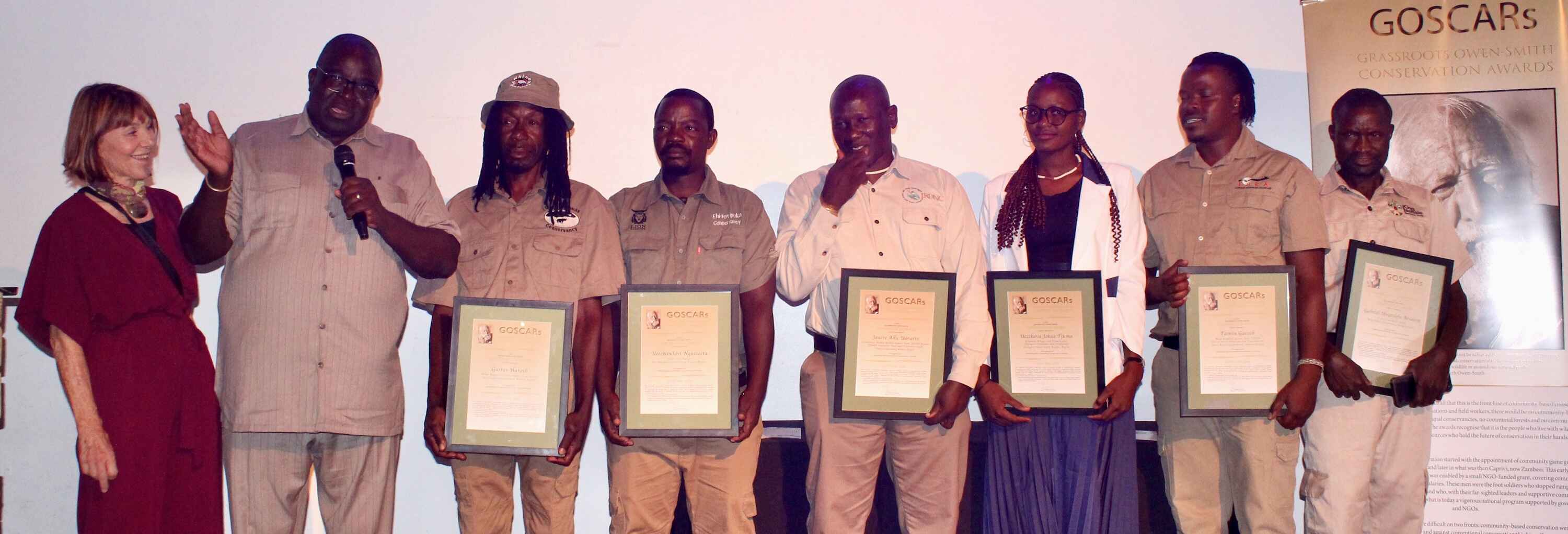 The award winners posing on stage.