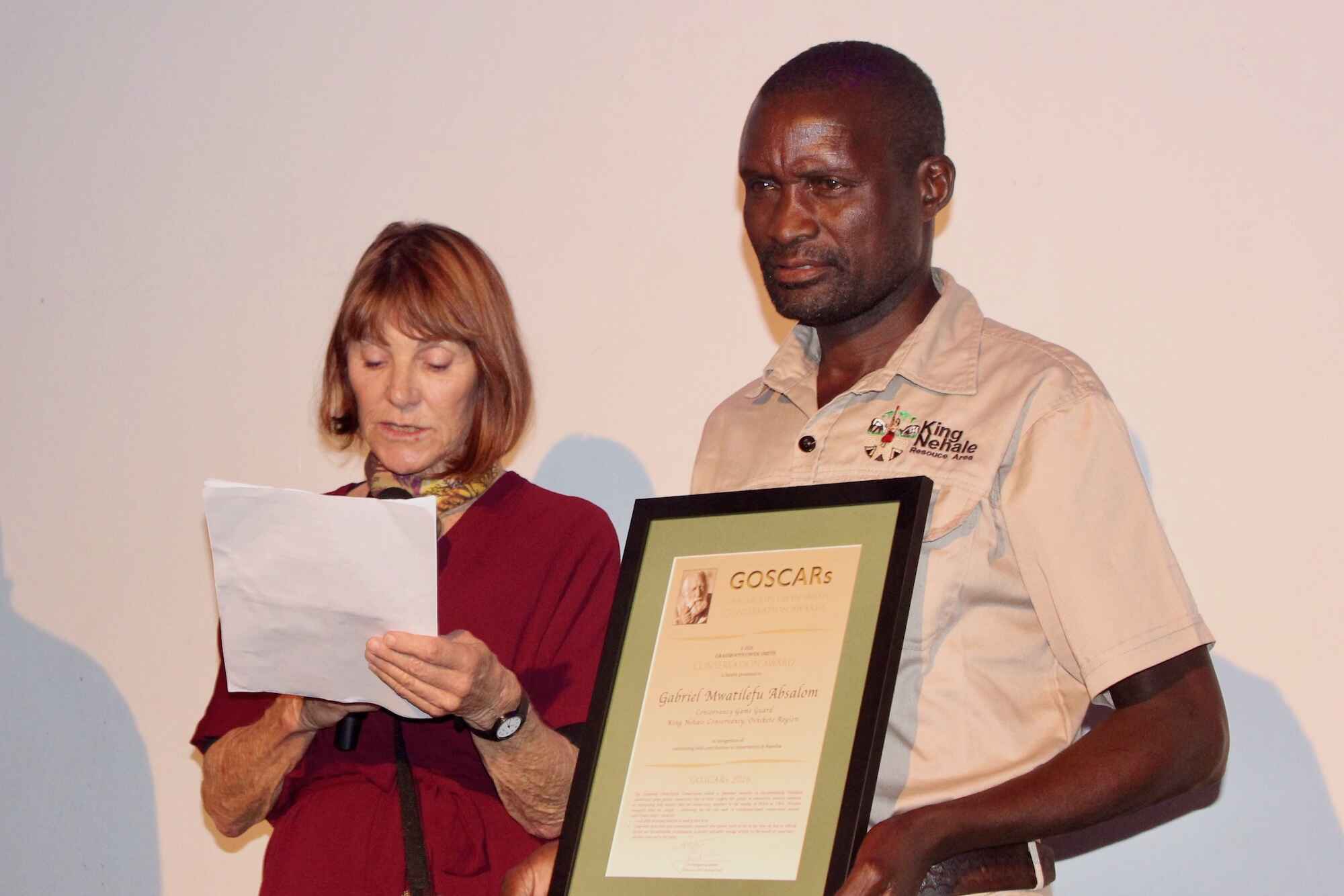 Gabriel Mwatilefu Absalom recieving his award.