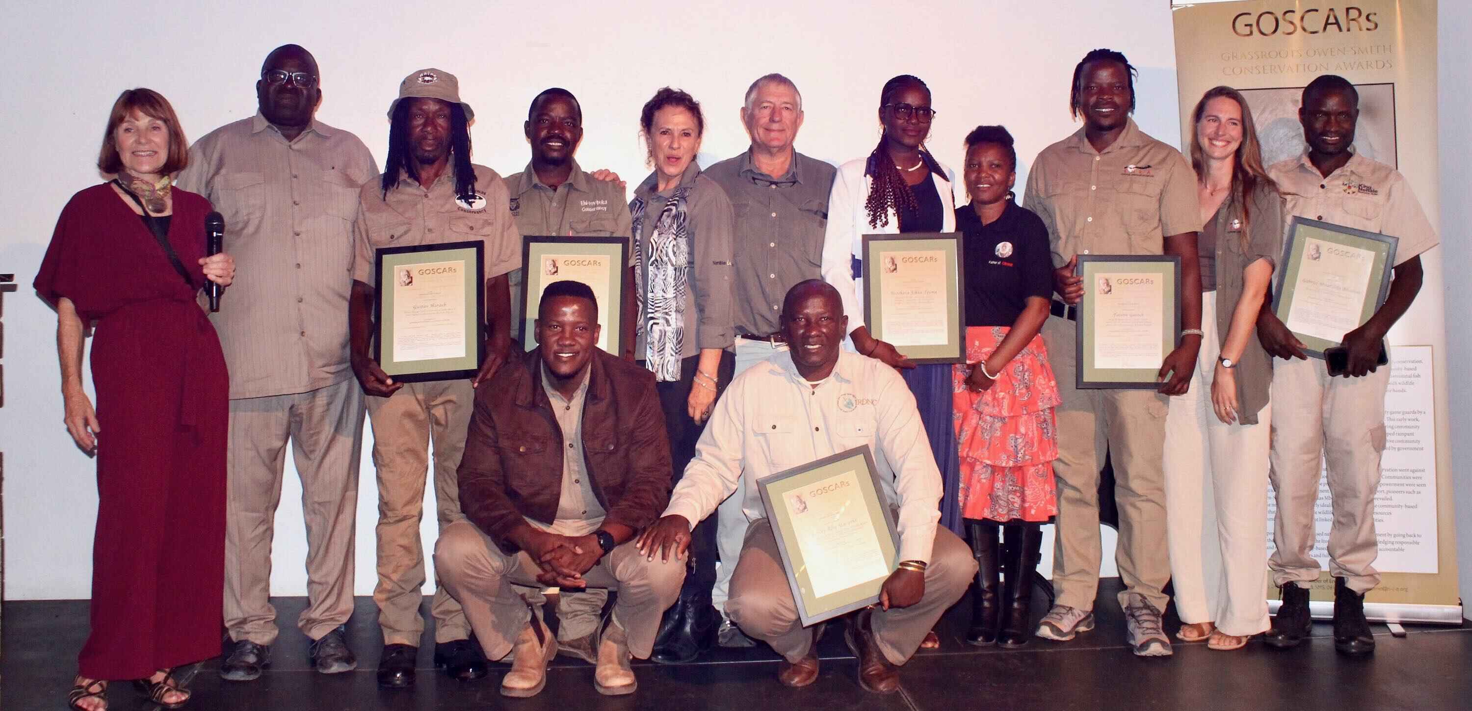 The award winners post together on stage.