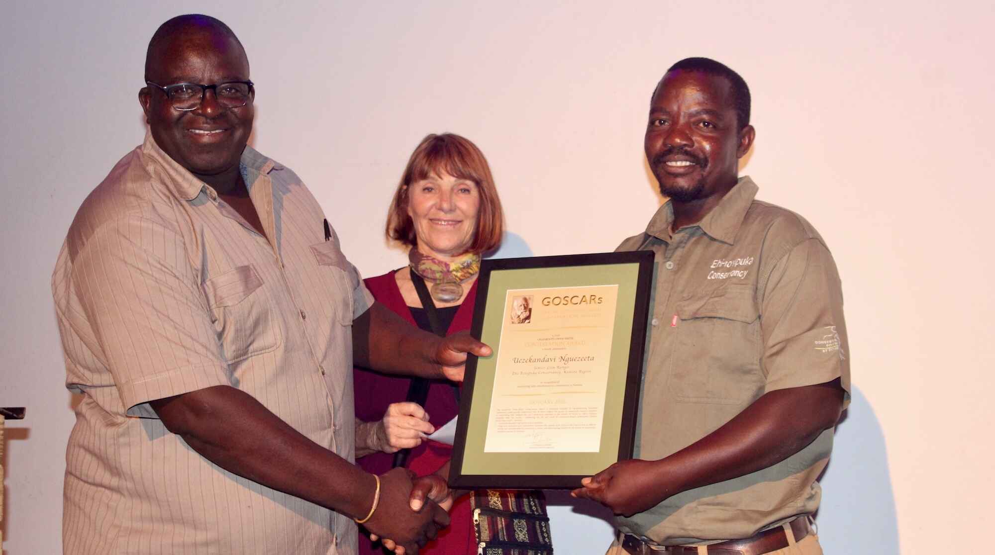 Uezekandavi Nguezeeta recieving his award.