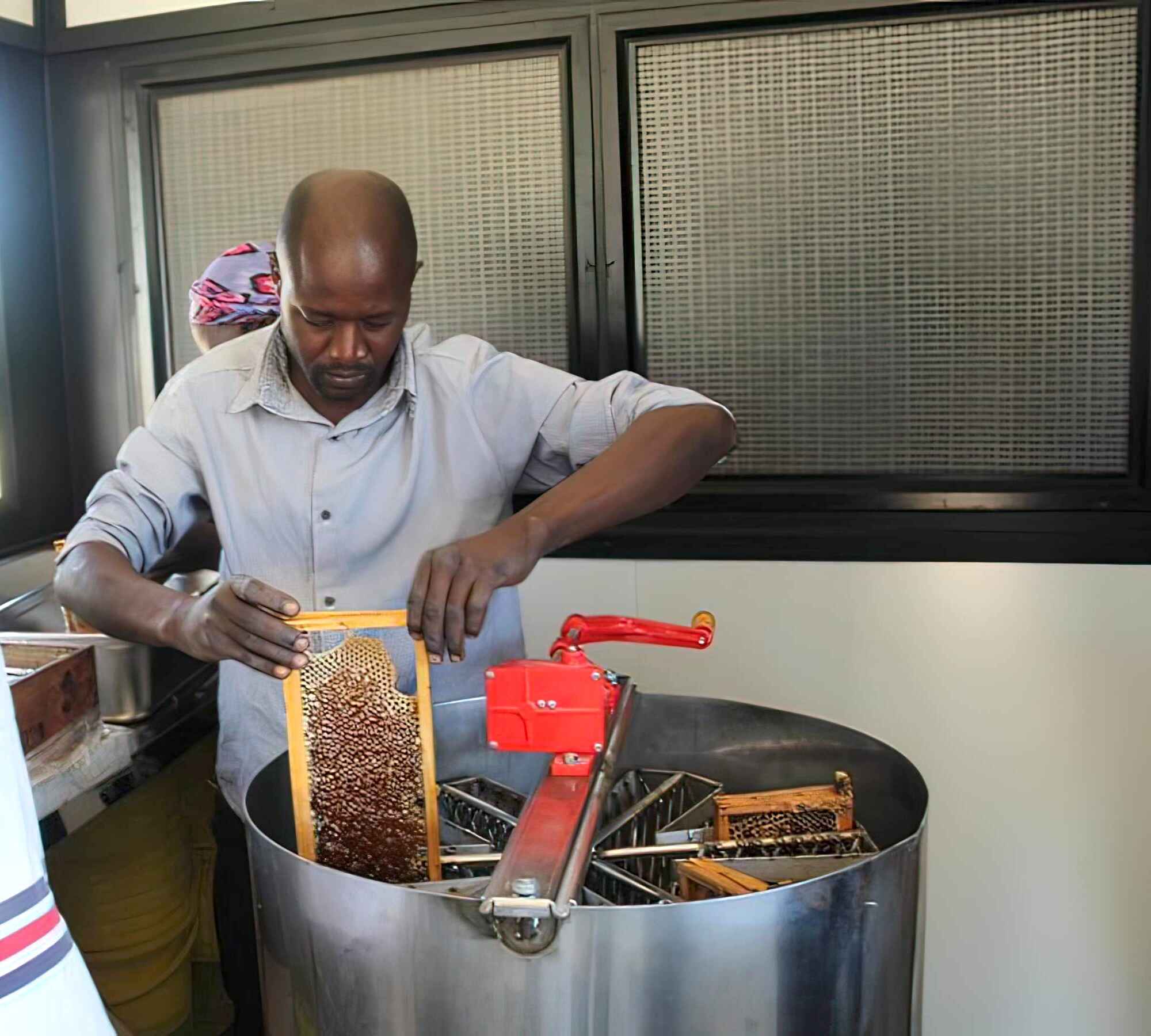 Raw honey being prepared for sale.
