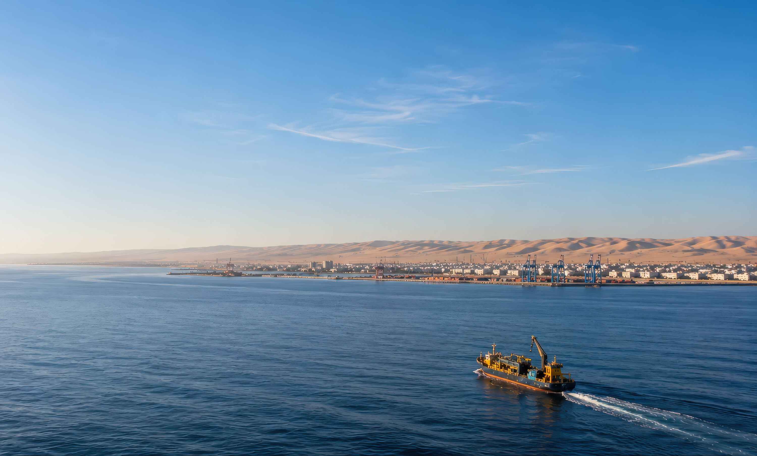 A mining vessel approaches a port.