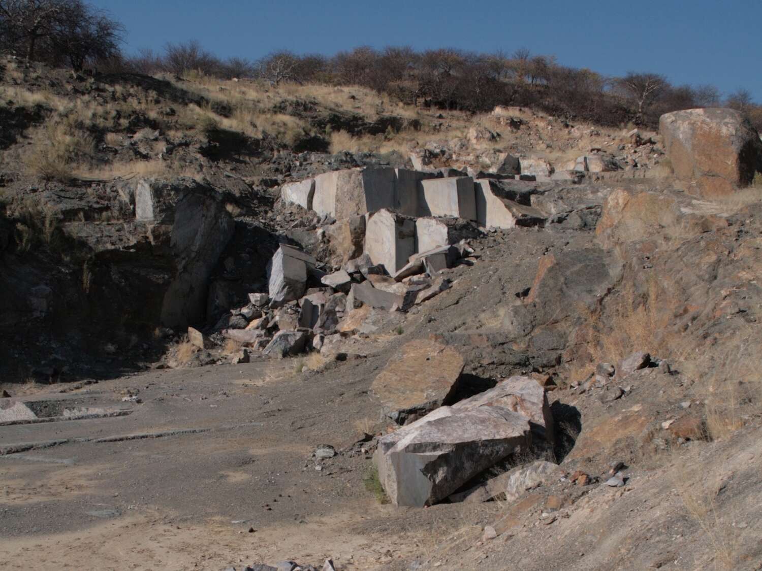 Rocks and tyre tracks in an untidy pile.