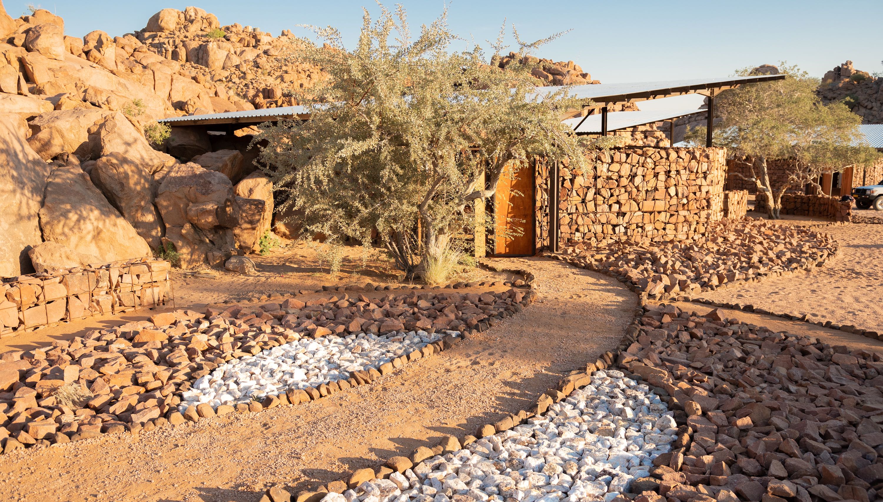 Wooden doors lead into a stone building.