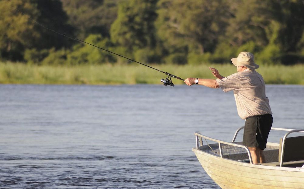 A man casts a fishing line.