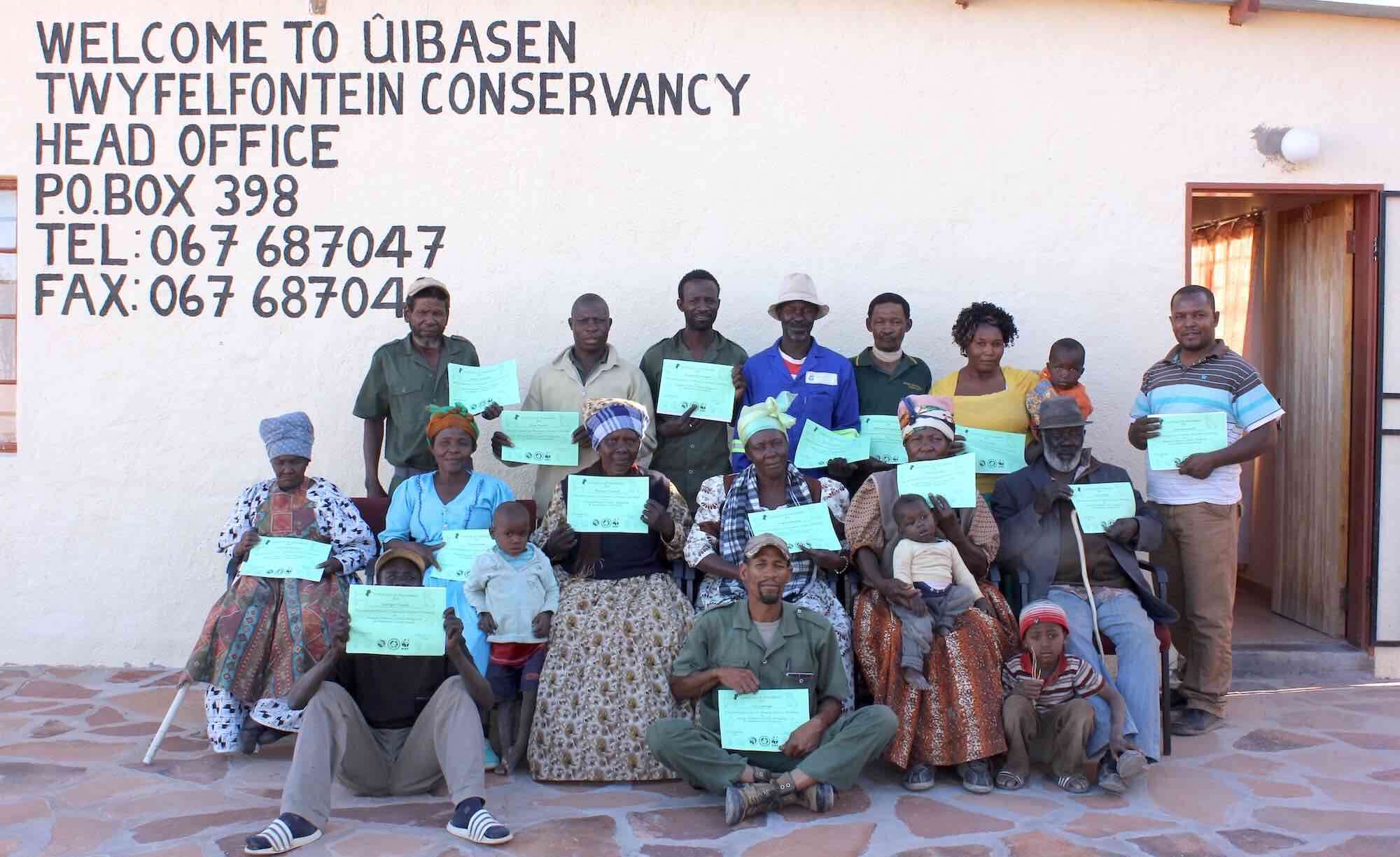 A group of conservancy members outside their office.